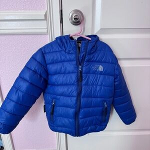 The North Face blue puffer hooded coat